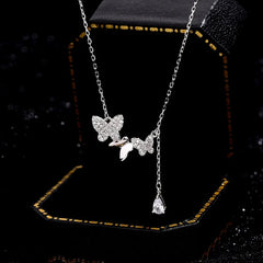Sterling Silver Butterfly Water Drop Tassel Necklaces worn to showcase its length and pendant detail