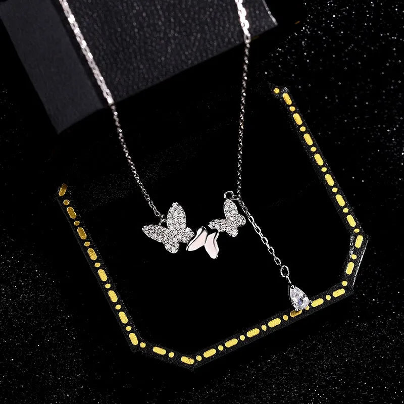 Detailed view of the Sterling Silver Butterfly Water Drop Tassel Necklaces chain and pendant
