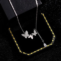 Detailed view of the Sterling Silver Butterfly Water Drop Tassel Necklaces chain and pendant