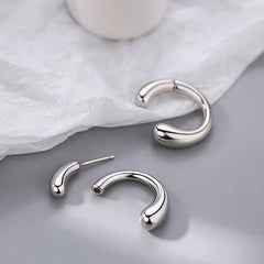 Angled view of the Sterling Silver C-Shaped Earrings
