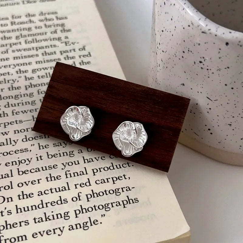 Angled view of the Sterling Silver Camellia Stud Earrings