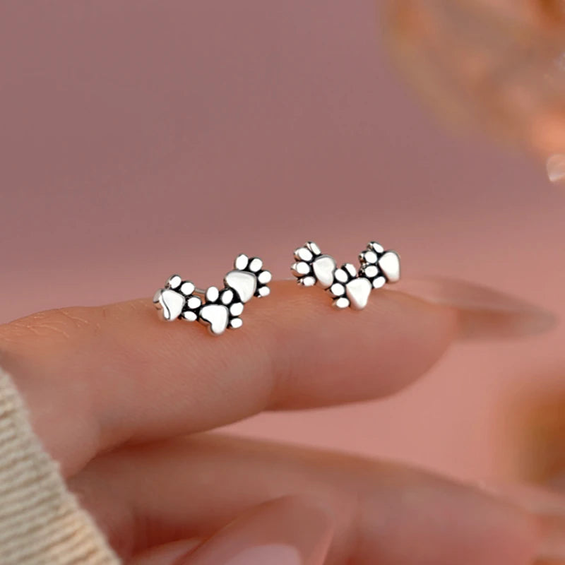 Model showcasing the dangle and style of the Sterling Silver Cat Claw Stud Earrings