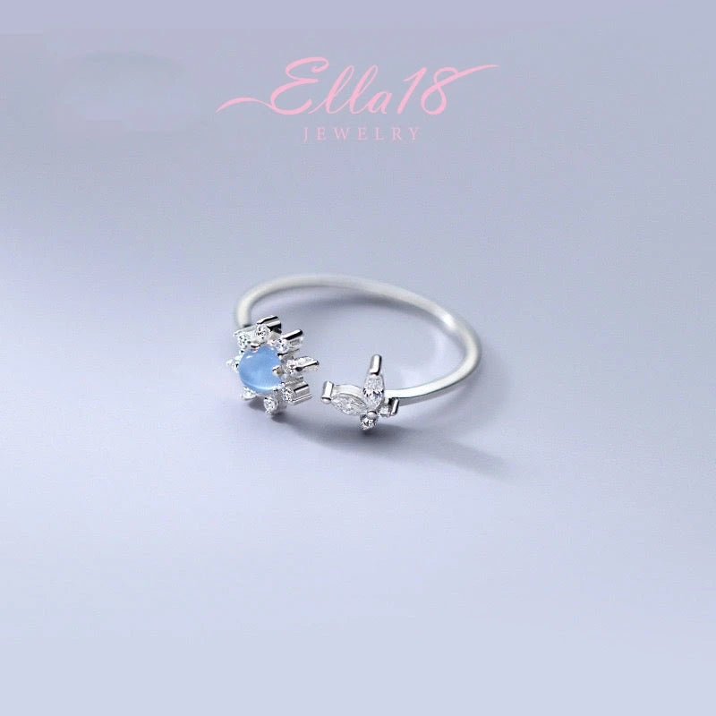 Close-up view of the gemstone and setting of the Butterfly Sunflower Ring