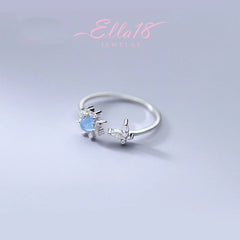 Close-up view of the gemstone and setting of the Butterfly Sunflower Ring