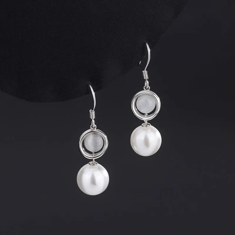 Close-up detail of the sparkling zircons and plating on the Pearl Ear Hooks