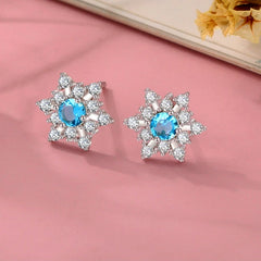 Angled view of the Sterling Silver Christmas Blue Diamond Snowflake Stud Earrings