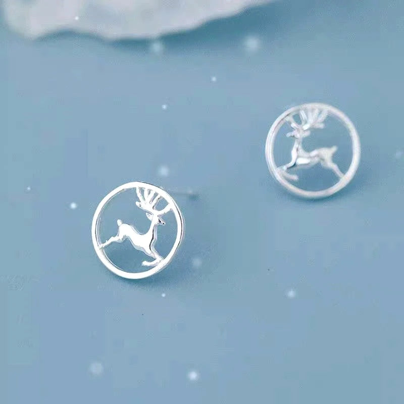 Model showcasing the dangle and style of the Sterling Silver Christmas Deer Stud Earrings