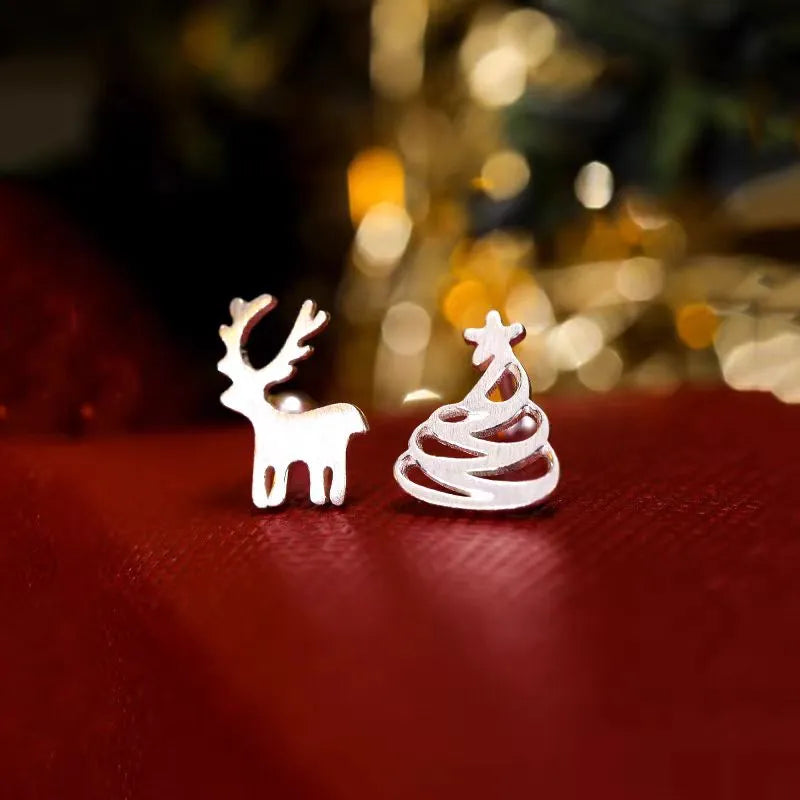 Angled view of the Sterling Silver Christmas Tree And Antler Asymmetrical Stud Earrings