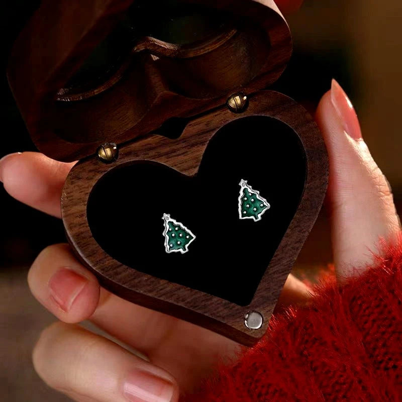 Model showcasing the dangle and style of the Sterling Silver Christmas Tree Stud Earrings