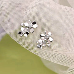 Close-up detail of the sparkling zircons and plating on the Clover Stud Earrings