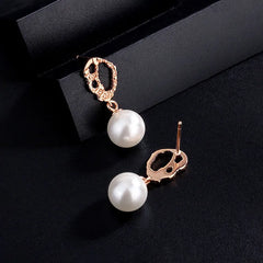 Close-up detail of the sparkling zircons and plating on the Pearl Earrings