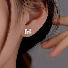 Model showcasing the dangle and style of the Sterling Silver Crab Stud Earrings