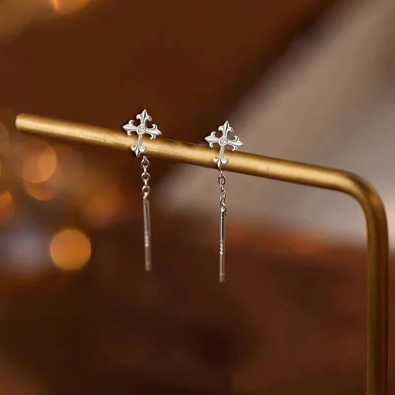 Close-up detail of the sparkling zircons and plating on the Cross Threader Earrings