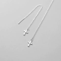 Model showcasing the dangle and style of the Sterling Silver Cross Threader Earrings