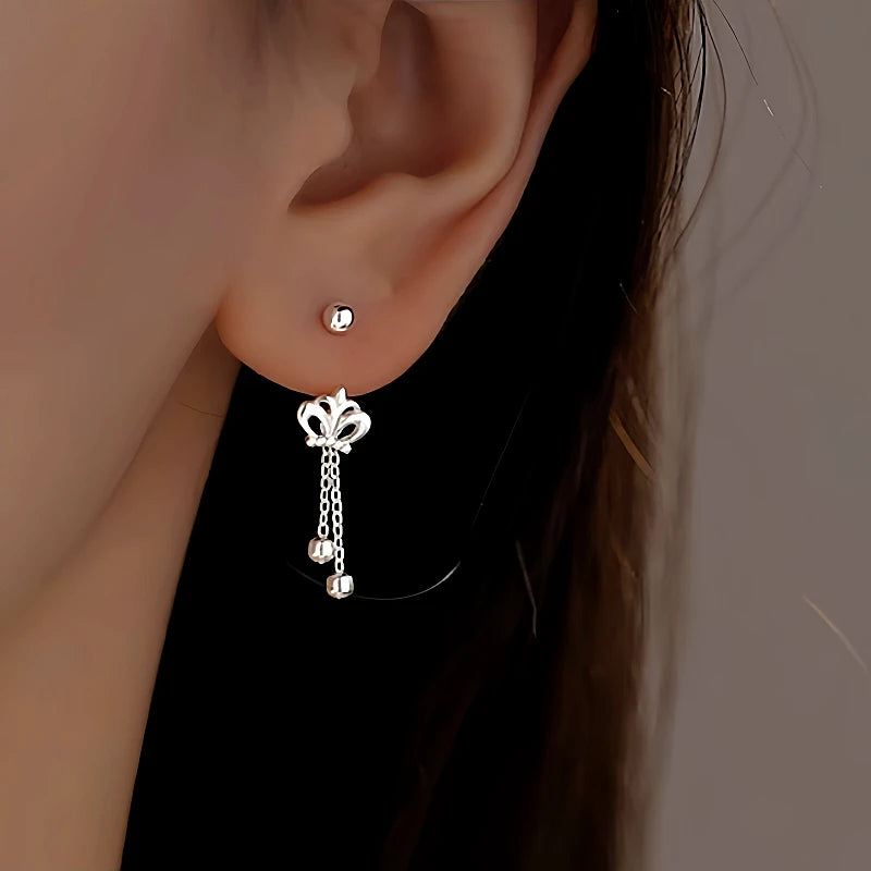 Angled view of the Sterling Silver Crown Tassel Screw Earrings