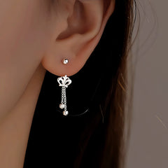 Angled view of the Sterling Silver Crown Tassel Screw Earrings