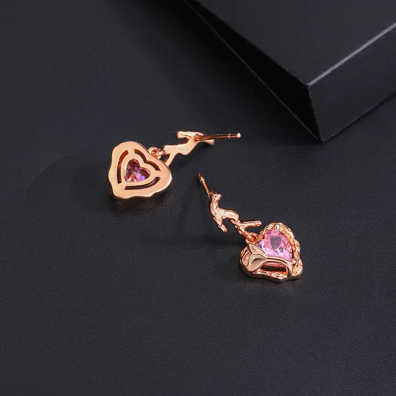 Close-up detail of the sparkling zircons and plating on the Pink Heart Earrings
