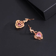 Close-up detail of the sparkling zircons and plating on the Pink Heart Earrings