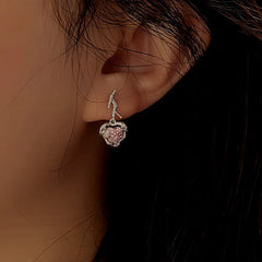 Angled view of the Sterling Silver Crystal Pink Heart Earrings