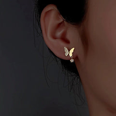 Model showcasing the dangle and style of the Sterling Silver Diamond Butterfly Earrings