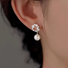 Close-up detail of the sparkling zircons and plating on the Hoop Pearl Earrings