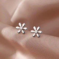 Close-up detail of the sparkling zircons and plating on the Daisy Stud Earrings
