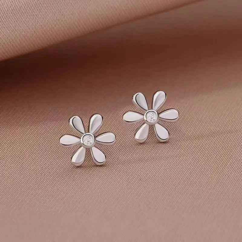 Angled view of the Sterling Silver Diamond Daisy Stud Earrings