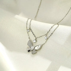 Close-up of the pendant and clasp on the Double-Layer Butterfly Necklace