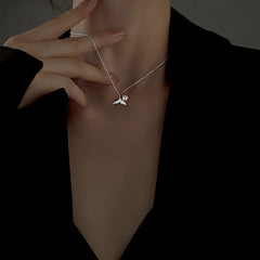 Detailed view of the Sterling Silver Diamond Fishtail Pearl Necklaces chain and pendant