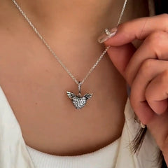 Sterling Silver Diamond Heart Angel Wing Necklace worn to showcase its length and pendant detail