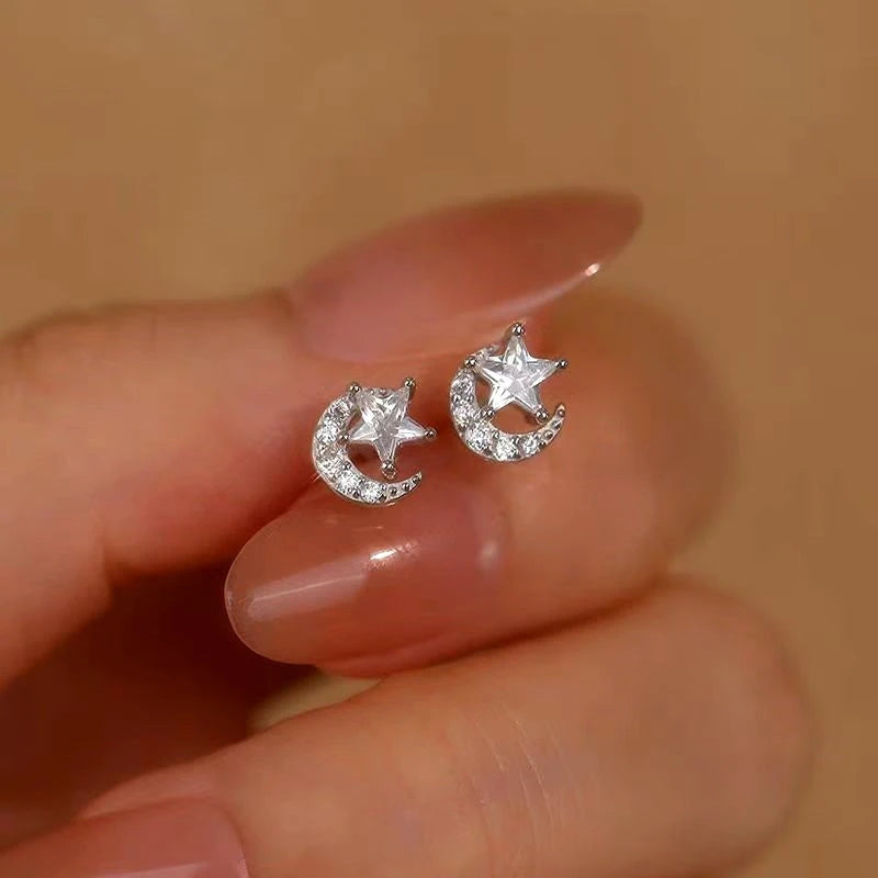 Model showcasing the dangle and style of the Sterling Silver Diamond Moon And Star Stud Earrings