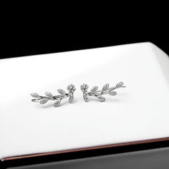 Close-up detail of the sparkling zircons and plating on the Four-Leaf Clover Bracelet