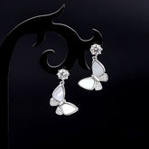 Model showcasing the dangle and style of the Sterling Silver Diamond Shell Butterfly Earrings