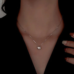 Sterling Silver Diamond Snake Heart Earrings worn to showcase its length and pendant detail