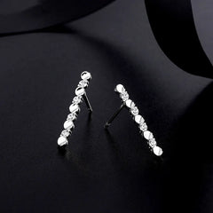 Close-up detail of the sparkling zircons and plating on the Moon and Star Earrings