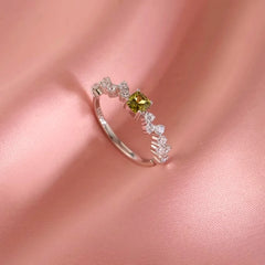 Close-up view of the gemstone and setting of the Snake Earrings