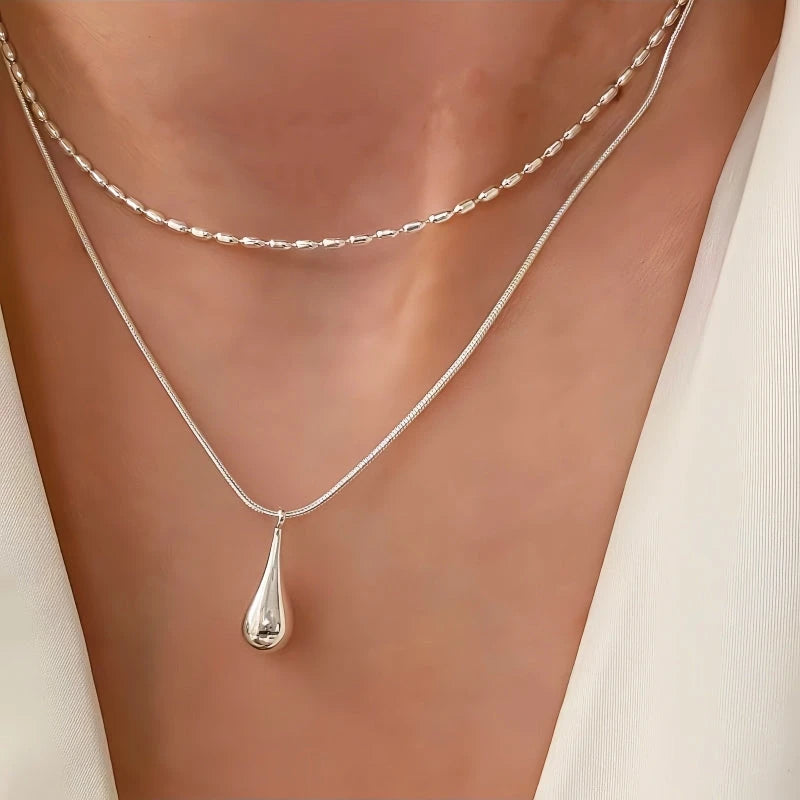 Sterling Silver Double-Layer Water Drop Necklace worn to showcase its length and pendant detail