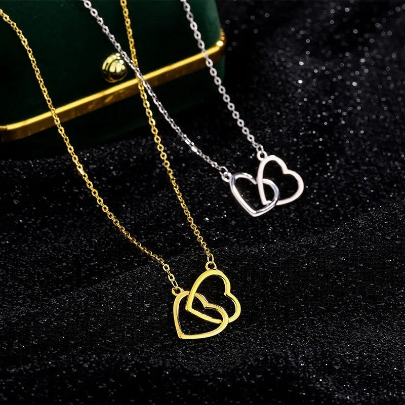 Sterling Silver Double Heart Necklaces worn to showcase its length and pendant detail
