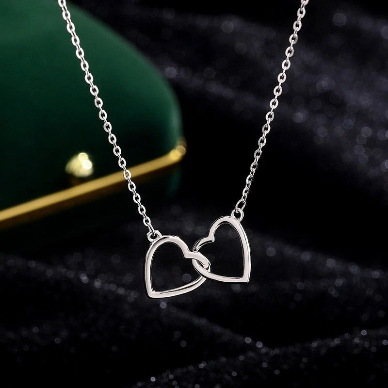Detailed view of the Sterling Silver Double Heart Necklaces chain and pendant