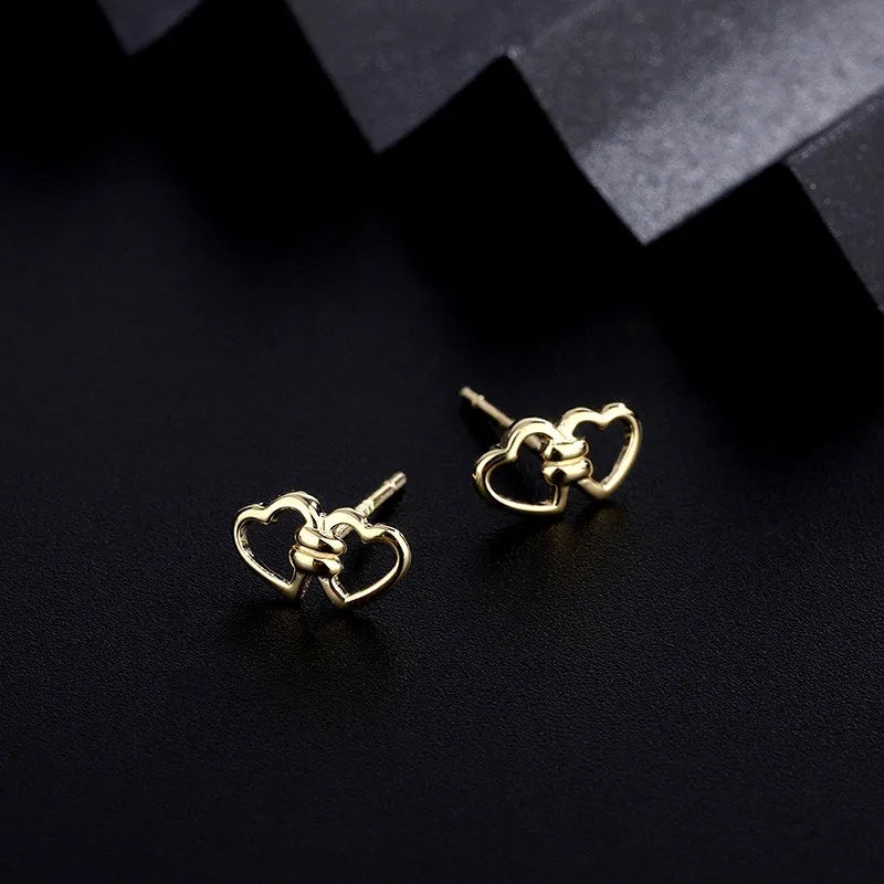 Angled view of the Sterling Silver Double Heart Stud Earrings