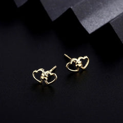 Angled view of the Sterling Silver Double Heart Stud Earrings