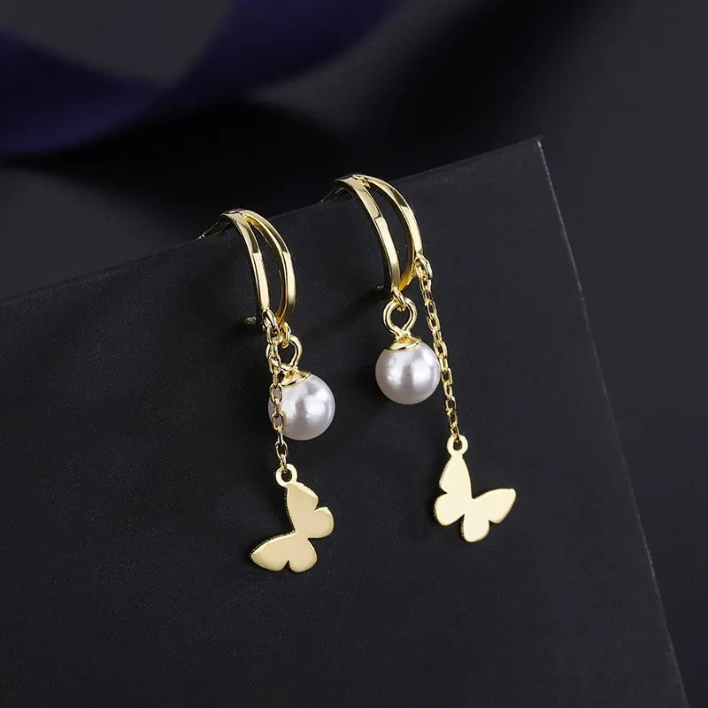 Angled view of the Sterling Silver Double Later Butterfly Pearl Earrings