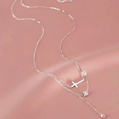 Sterling Silver Double Layer Stacked Cross Pearl Necklaces worn to showcase its length and pendant detail