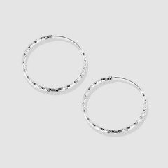 Close-up detail of the sparkling zircons and plating on the Double Star Earrings