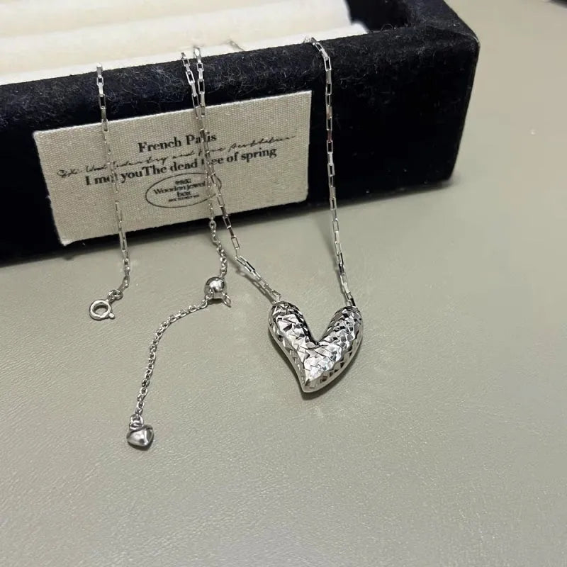 Detailed view of the Sterling Silver Elegant Broken Heart Necklace chain and pendant