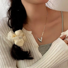 Close-up of the pendant and clasp on the Clover Bracelet