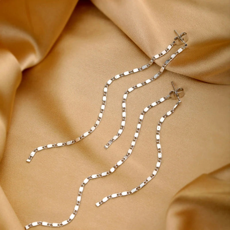 Close-up detail of the sparkling zircons and plating on the Snake Stud Earrings