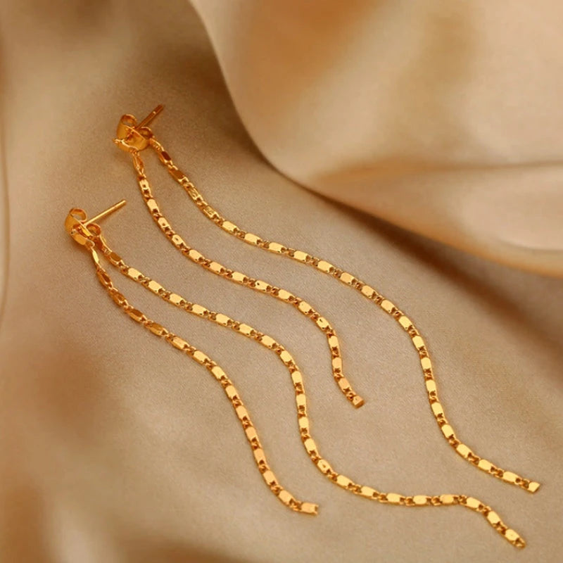 Angled view of the Sterling Silver Elegant Chain Tassel Earrings