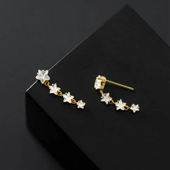 Angled view of the Sterling Silver Elegant Crystal Star Tassel Earrings