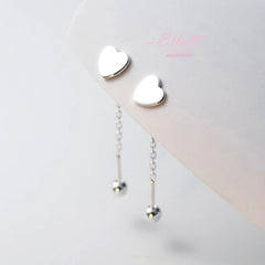 Model showcasing the dangle and style of the Sterling Silver Elegant Heart-Design Threader Earrings